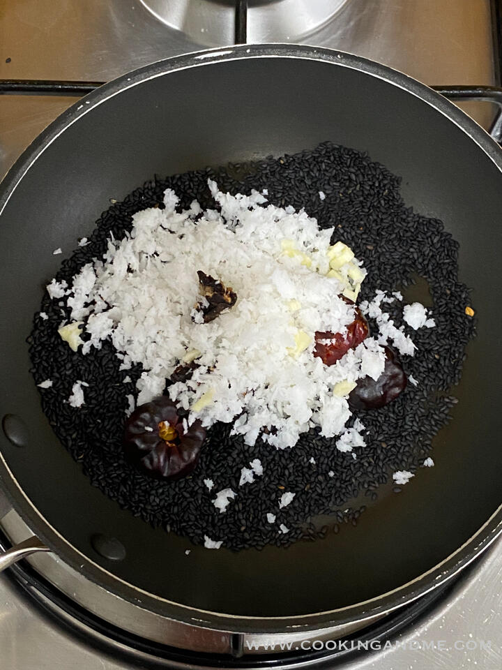 adding coconut to ellu chutney