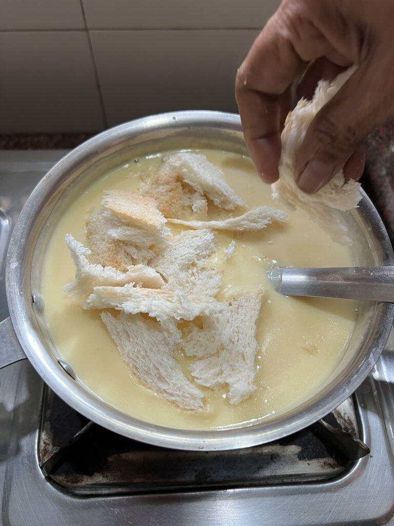 eggless bread pudding - adding bread slices